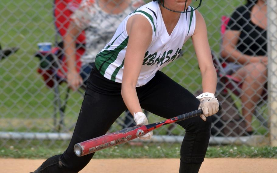 Kubasaki second baseman Leah Bebout drops a bunt single against American School In Japan during Thursday's doubleheader opener. The Dragons won both games by run rule and improved to 3-2 against American teams this season. Bebout got the win in the nightcap, her first regular-season win as a Dragons varsity pitcher.