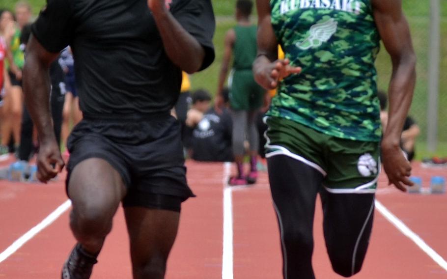 Zama's Jaelen Baker and Kubasaki's Mahlik Francis run side by side in the 100-meter dash Friday in the 12th Mike Petty Memorial Meet at Camp Foster on Okinawa. Matt Wong of Tiyan surprised the two, the senior edging out both for the win.