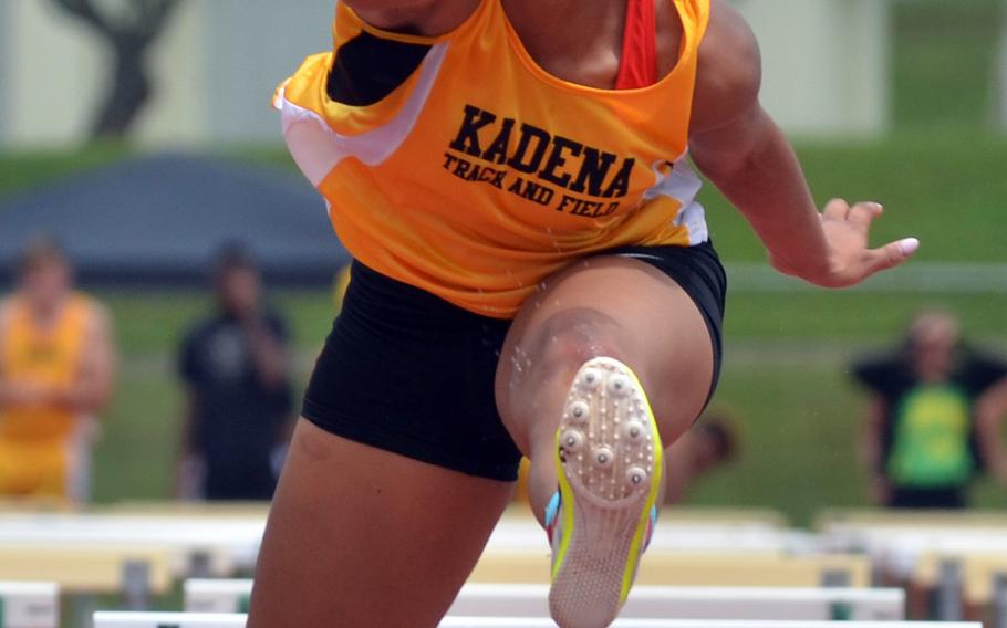 Kadena's Tiarrah Edwards negotiates the final hurdle en route to winning the 100-meter hurdles and remaining unbeaten in the event this season.