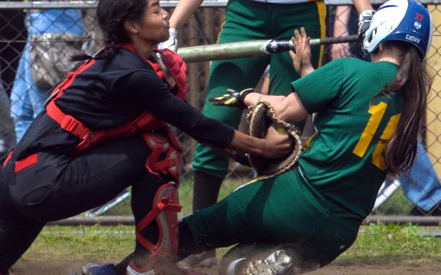 King catcher Zanetta Boyd tags out Edgren baserunner Naomy Montanez during Friday's DODEA-Japan softball tournament quarterfinal, won by the Cobras 7-3.