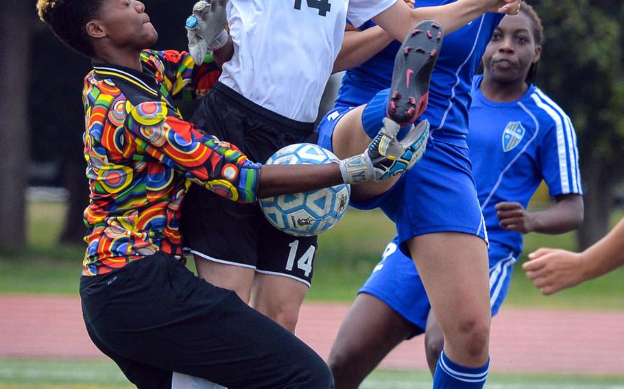 Zama goalkeeper Saige Rivers corrals the ball next to teammate Isabella Malovic and Yokota's Sarah Cronin during Saturday's DODEA-Japan girls soccer tournament third-place match. Cronin had the lone goal in a 1-0 Panthers win.