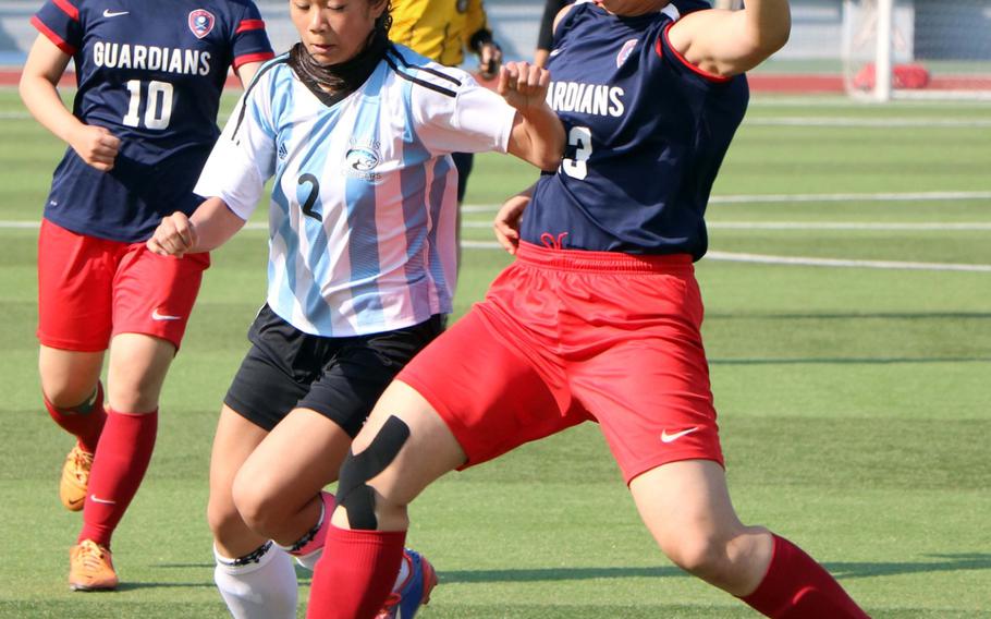 Osan's Andrea Carandang, middle, and Yongsan International-Seoul's Suzy Kim scrum for the ball as Guardians teammate Jane Kim watches during the Korea Blue tournament semifinal on Friday, April 29, 2016. Osan won, 2-1.


