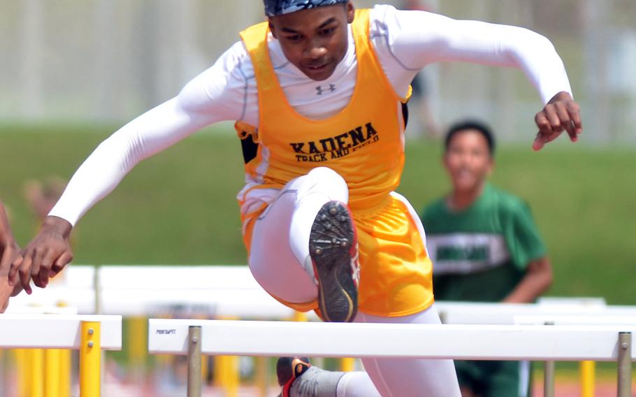 Kadena's Elijah Tuck negotiates the final hurdle en route to victory in 16.21 seconds in the boys 110-meter hurdles during Saturday's final regular-season Okinawa track and field meet. Tuck won both the 110 and 300 hurdles, the first time he's done that this season.