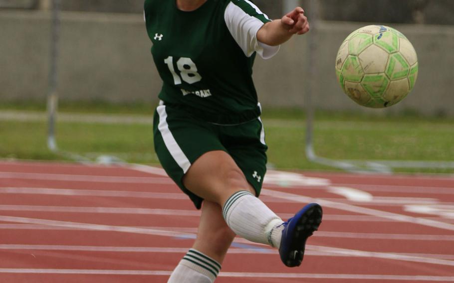 Kubasaki's Reiko Lemasters boots the ball against Kaiho during Sunday's girls soccer game, won by the Dragons 8-0.