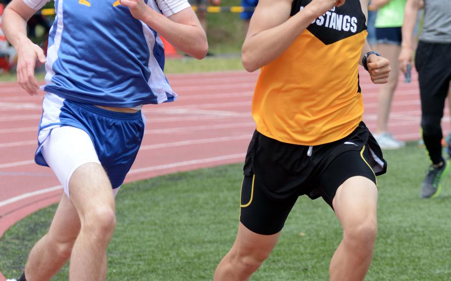 Seniors Daniel Galvin of Yokota and Evan Yukevich of American School In Japan run side-by-side in the 1,600 during Saturday's Kanto Plain finals. Galvin ran 4:18.22 to regain the record from Yukevich, who ran 4:21.64 in March at Zama.