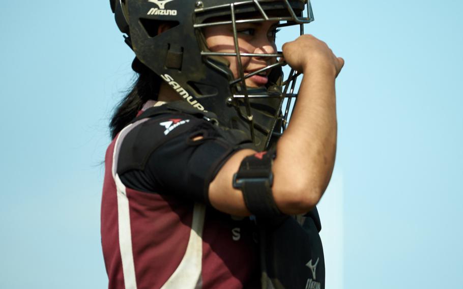 Matthew C. Perry's Tiarra Blanco adjusts her mask during a pool play game against Robert D. Edgren on Monday, May 16, 2016 at the Far East Tournament in Yokota, Japan.