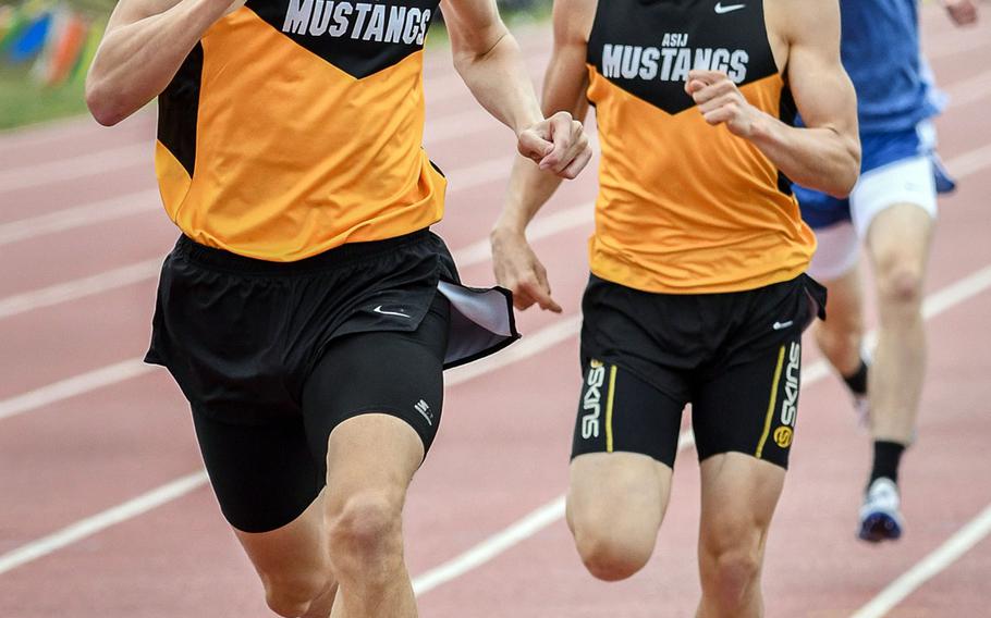 American School In Japan junior Britt Sease leaves senior teammate Evan Yukevich and Yokota senior Daniel Galvin in trail coming to the finish of the Far East meet 800. Sease, the region record holder with a 1:54.63, clocked a 1:55.54, matching Galvin's meet record set two years ago, to the hundredth of a second.