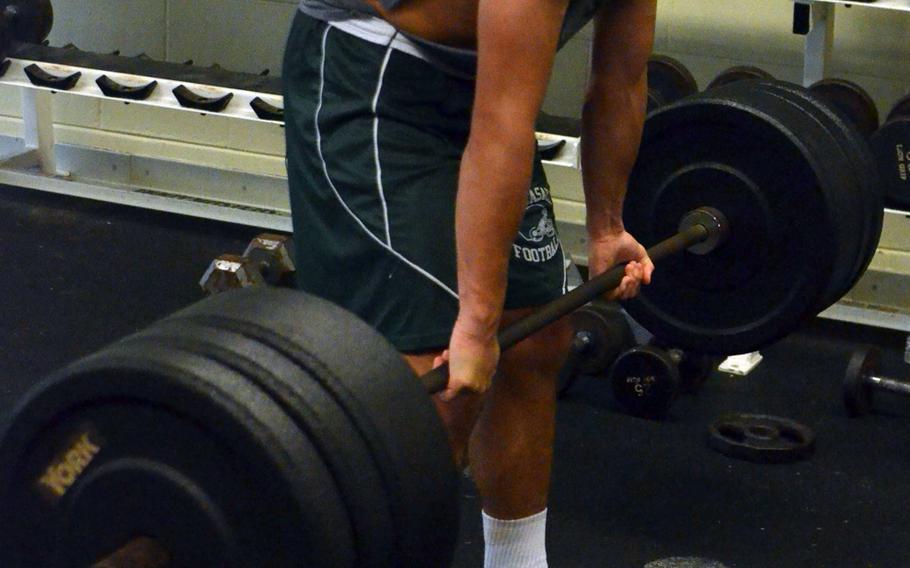 Senior Robby Riegert performs a deadlift in the Kubasaki weight room.