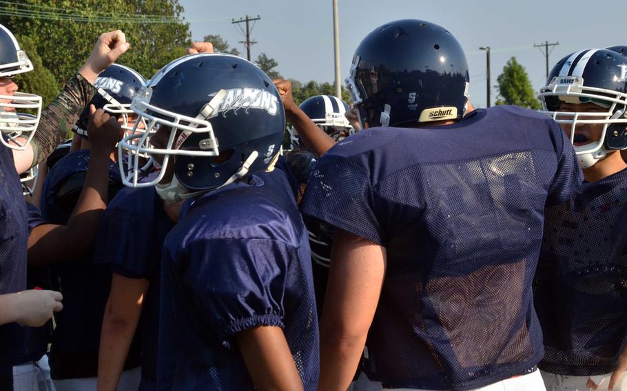 Seoul American Falcons break the huddle near the end of practice.