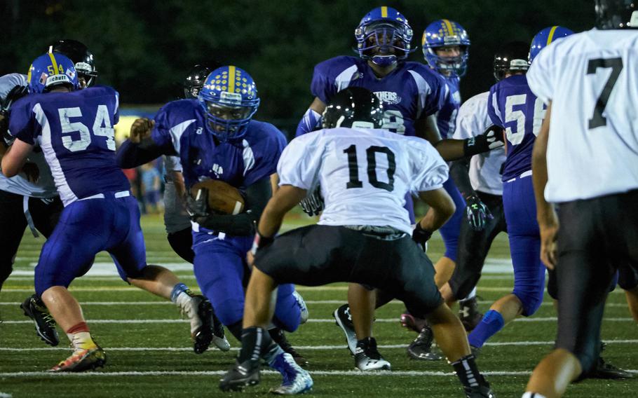 Yokota running back Shomari Tindal looks for a lane as Zama linebacker Ziaire Johnson defends in the first game of the 2016 DODEA-Japan season Friday, Sept. 2, 2016, at Yokota Air Base, Japan's Bonk Field. Yokota defeated Zama 22-6.