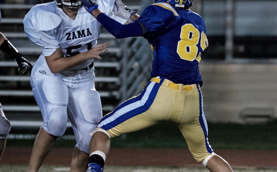 Zama offensive tackle Jessica Brantley fends off Yokota linebacker Renyck Robertson during the third quarter of Zama's game against host Yokota on Friday, Sept. 23, 2016 at Yokota Air Base, Japan. Yokota defeated Zama 41-6. 