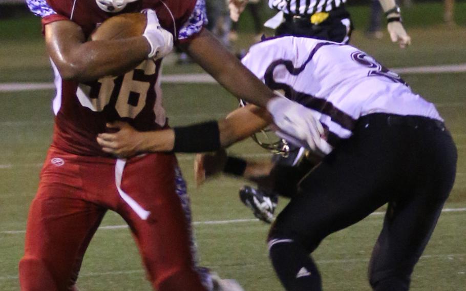 Nile C. Kinnick running back Harry Cheng rushed for two touchdowns against Matthew C. Perry during Saturday's game. The Red Devils beat the Samurai 48-18.