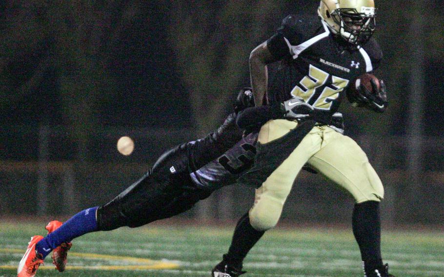 Humphreys freshman RB David Key drags a Sondgo defender with him as he carries the ball during Saturday's game. The Blackhawks soared past the Rhinos 45-6.