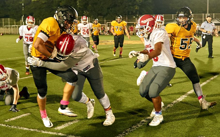 Kinnick defensive lineman Jamar Hargress forces ASIJ running back Andrew Howe out of bounds during the Devils game against the host Mustangs Saturday, Oct. 1, 2016 in Chofu, Japan. Kinnick defeated ASIJ 29-22.