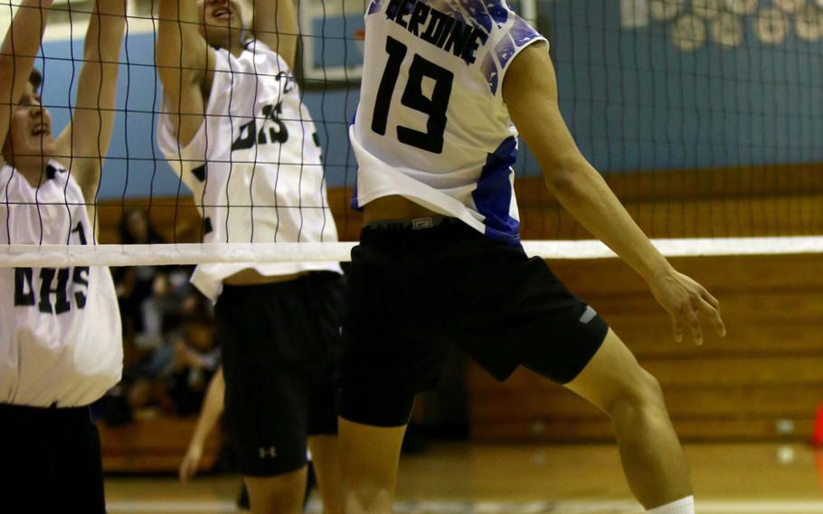 Seoul American's  Danny Berdine tries to tip the ball past Daegu's Gage Zach and Brannin Jackson during a volleyball match at Falcon Gym Friday, Oct. 7, 2016. The Falcons beat the Warriors twice, each in straight sets.

