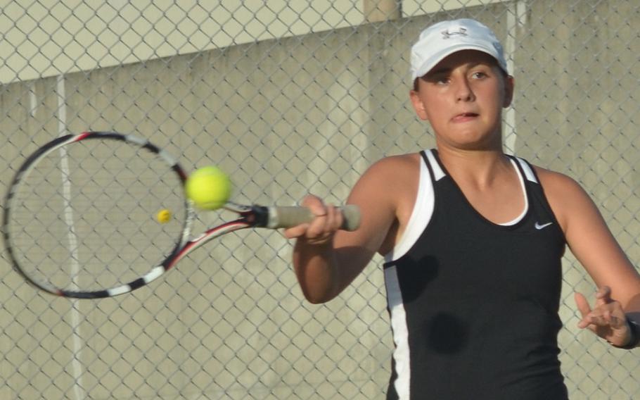 Kadena's McKenna Murphy slaps a forehand return against Kubasaki's Adelle Ashby during the tennis tie at Kubasai High School Friday, Oct. 7, 2016. Ashby won 6-0, 6-1 and the Dragons beat the Panthers 5-1 as a team.

