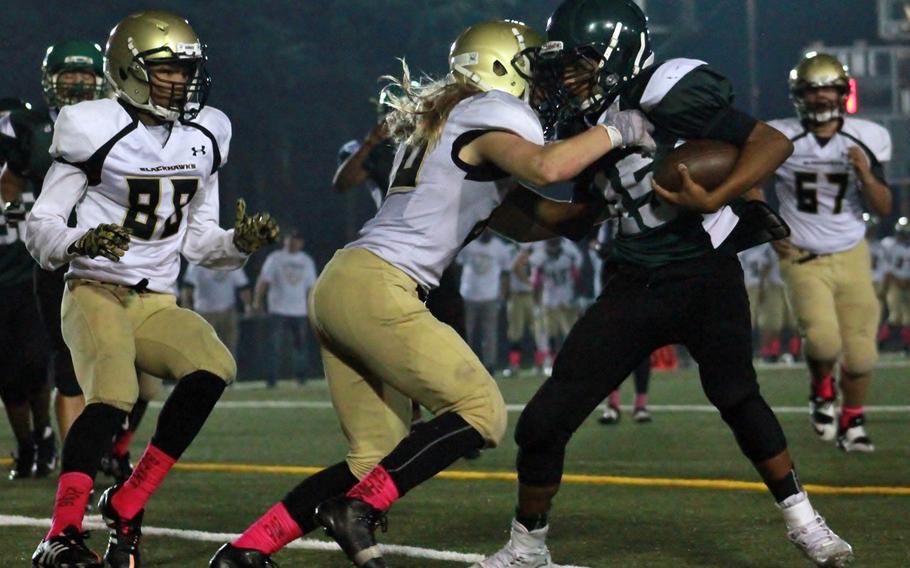Humphreys' Tyrell Alexande, left,r and Owen "Thor" Williams close in on Daegu's Jaeveon Bell.