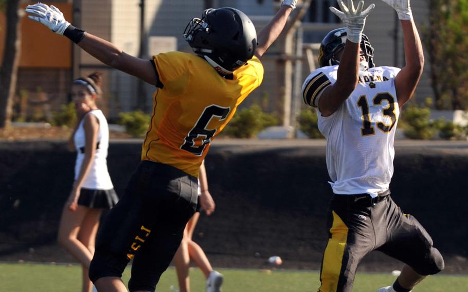 American School In Japan's Sho Hatakeyama and Kadena's Donte Savoy go for the ball.