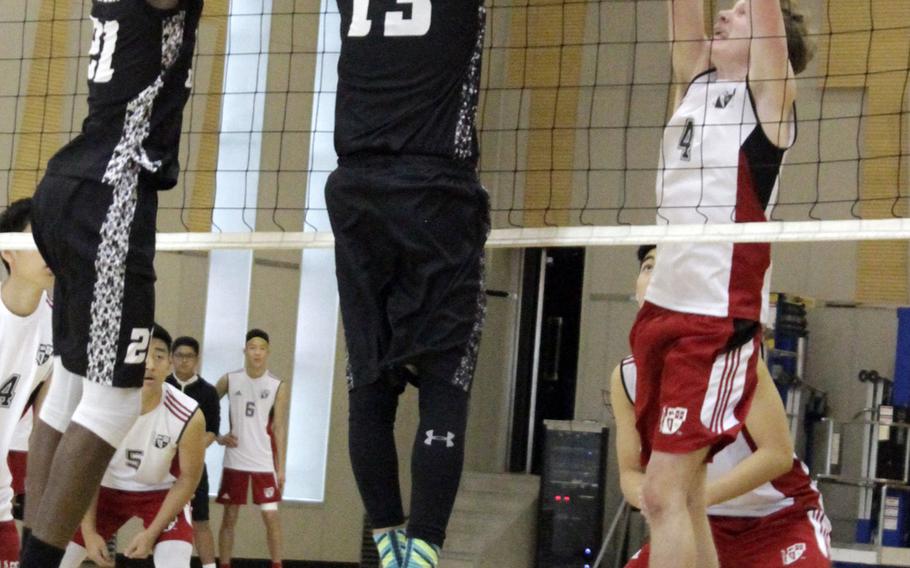 Osan's Darius Dawson and Matthew Burbee go up against Seoul Foreign's Ghye Brown at the net during Friday's Korea Blue volleyball tournament match. The Crusaders won 25-14, 25-17, 25-18.