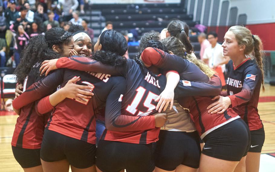 The Nile C. Kinnick volleyball team celebrates its 10th consecutive DODEA-Japan Tournament championship Saturday, Oct. 29, 2016 at Naval Base Yokosuka, Japan. The Red Devils rallied to defeat Yokota 16-25, 25-14, 17-25, 25-18, 15-12.