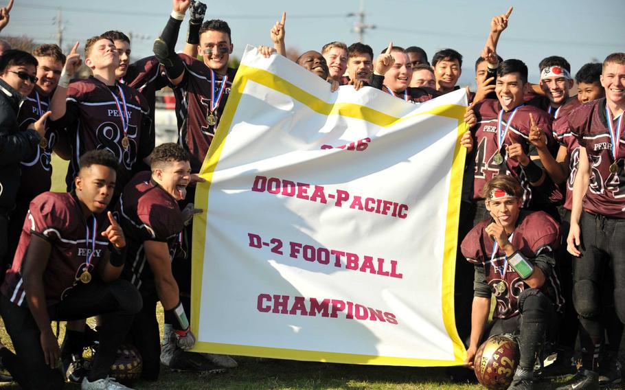 Banner time for Matthew C. Perry Samurai football. They beat Humphreys 44-6 in Saturday's Division II title game, the school's first Far East gridiron championship.