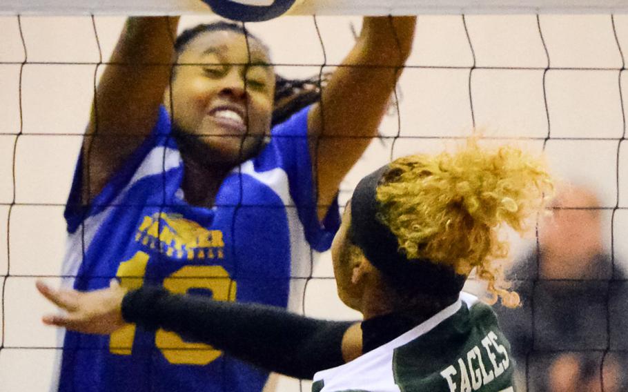 Yokota's Britney Bailey blocks a shot by Edgren's Coko Magby during Monday's pool-play match in the Far East Division II volleyball tournament. The Panthers won 25-20, 25-21, 25-15.