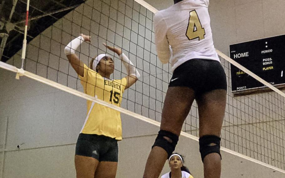 Humphreys' Ryan Duncan tries to hit past Robert D. Edgren's Coko Magby during Tuesday's pool-play match in the Far East Division II volleyball tournament. The Eagles won 25-20, 19-25, 25-23, 25-12.