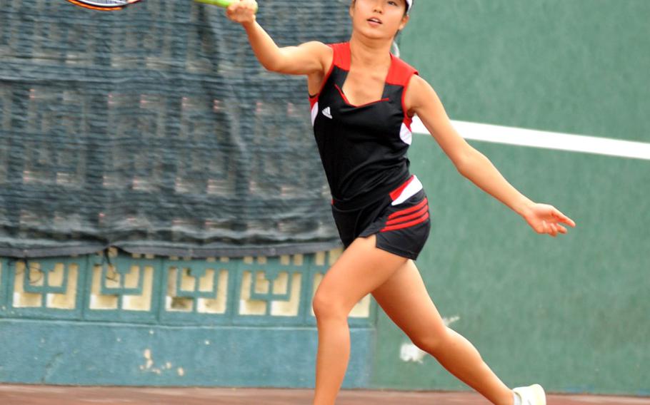 E.J. King's Megumi Kodama chases down a forehand return during Wednesday's Far East tennis tournament girls doubles consolation match. Kodama and her partner Haru Bellwood lost to Seisen's Amana Fujikawa and Lauren Woody 8-1.