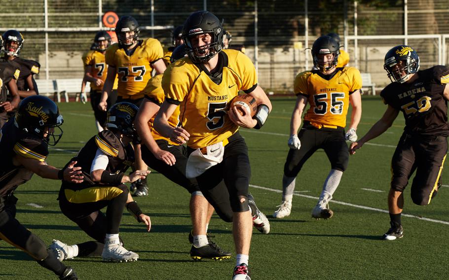 ASIJ quarterback Jack Ambrosino scrambles out of the pocket while looking for the end zone during the third quarter of the Far East Division I Football Championship Saturday at the American School in Japan in Chofu, Japan. Ambrosino would score at the end of the play. 