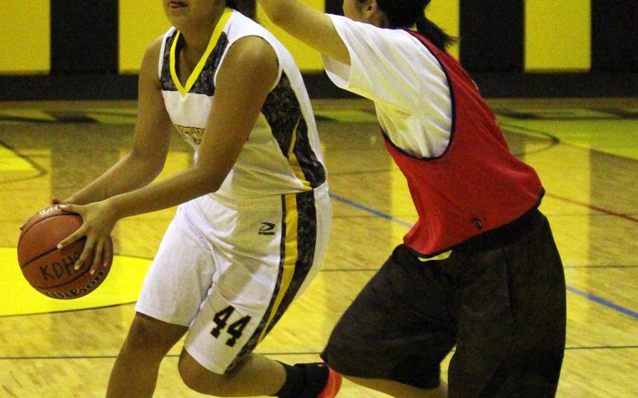 Kadena Panthers forward Gracie Graham readies a shot against the Futenma Red Braves during Monday's girls basketball game. Defending Far East Division I champion Kadena fell 54-44.