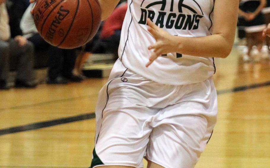 Kubasaki's Chloe' Stevens drives to the basket on Kadena during Friday's girls basketball game. Stevens had 19 points in a losing effort as the defending Far East Division I champion Panthers beat the Dragons 51-25.