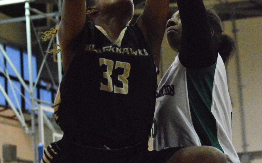 Humphreys' Jaedyn Jones goes up for a shot against Daegu's Kennedi Williams during Wednesday's girls basketball game, won by the Blackhawks 34-16.
