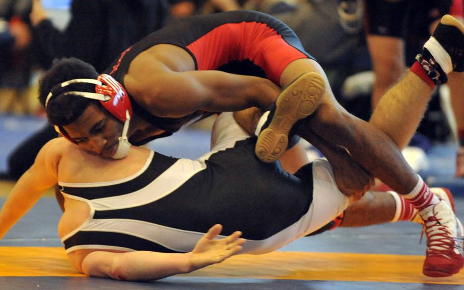 Nile C. Kinnick 129-pounder Devoney Stanley tries to turn Zama's Carter Whitton during the title bout in Saturday's "Beast of the Far East" wrestling tournament. Stanley pinned Whitton for the title.