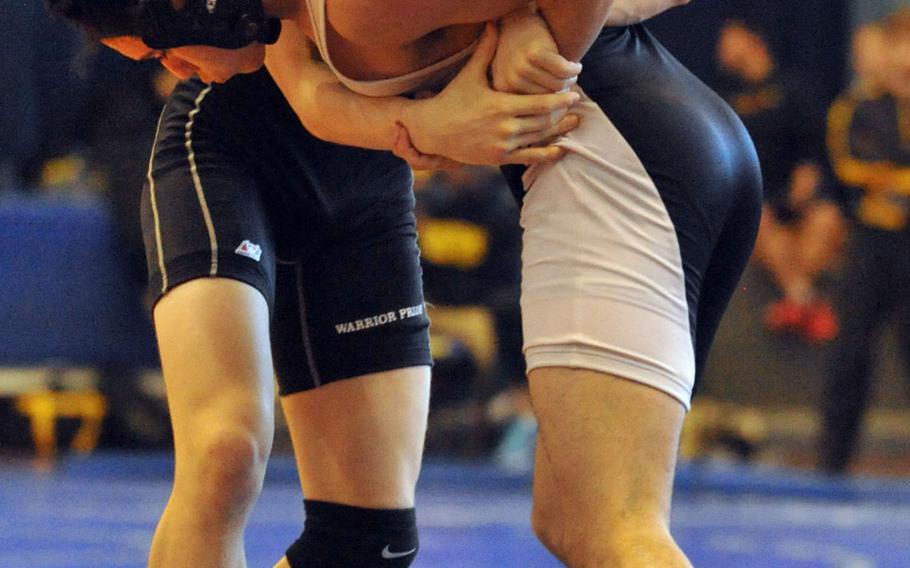 Daegu 148-pounder Hunter Lane tries to lift Zama's Curtis Blunt during the title bout in Saturday's "Beast of the Far East" wrestling tournament.  Lane, a Far East runner-up a year ago, won by technical fall 10-0 in 2 minutes, 58 seconds. He was one of just two Daegu wrestlers in the tournament; the other, Jake Dexter, took third at 158.