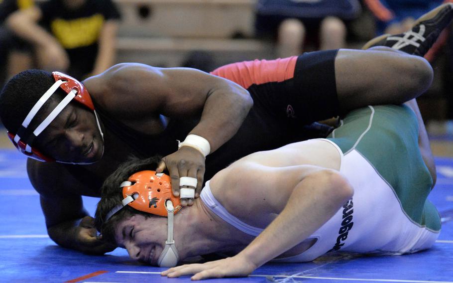 Nile C. Kinnick 180-pounder Dwayne Lyon gains control of Kubasaki's Nick Burwell during the title bout in Saturday's "Beast of the Far East" tournament. Lyon, a defending Far East champion, won by technical fall 13-0 in 3 minutes, 15 seconds.