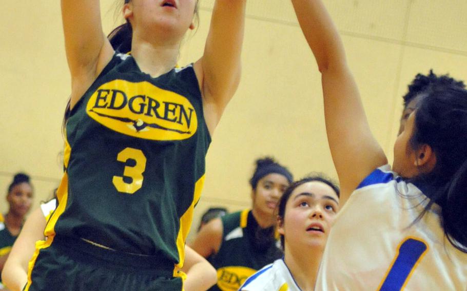 Robert D. Edgren's Karen Anastos shoots against Christian Academy Japan's Yeonjoo Kim on Day 1 Thursday of the first ASIJ Kanto Classic. The Eagles beat the Knights 39-30.