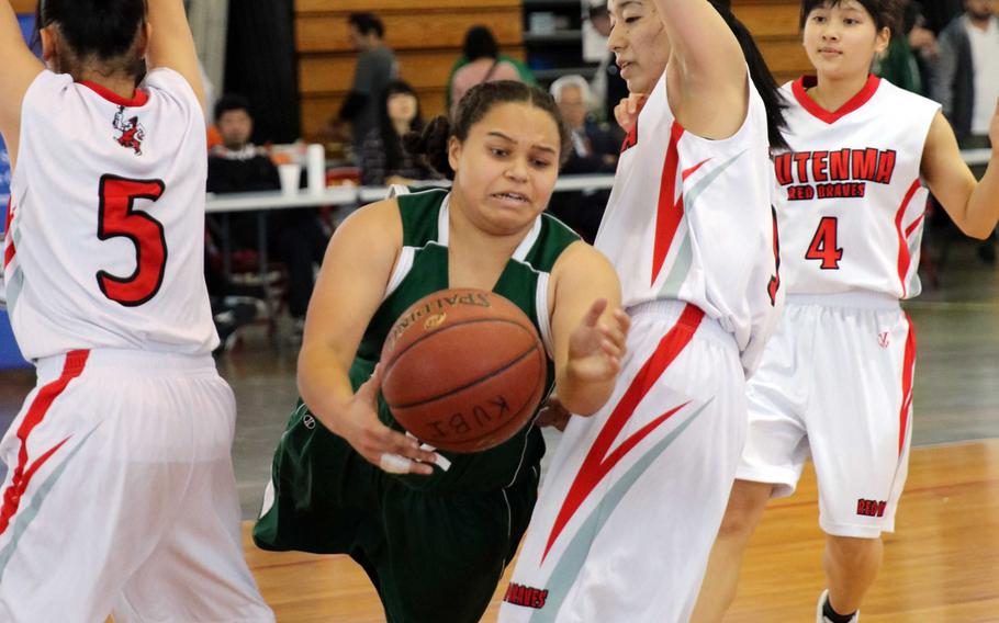 Kubasaki's Ceara King loses her purchase and the ball against Futenma during Saturday's pool-play game in the 11th Okinawa-American Friendship Basketball Tournament. The Dragons lost 49-13, then later fell in their first-round playoff game and were relegated to Sunday's consolation round.