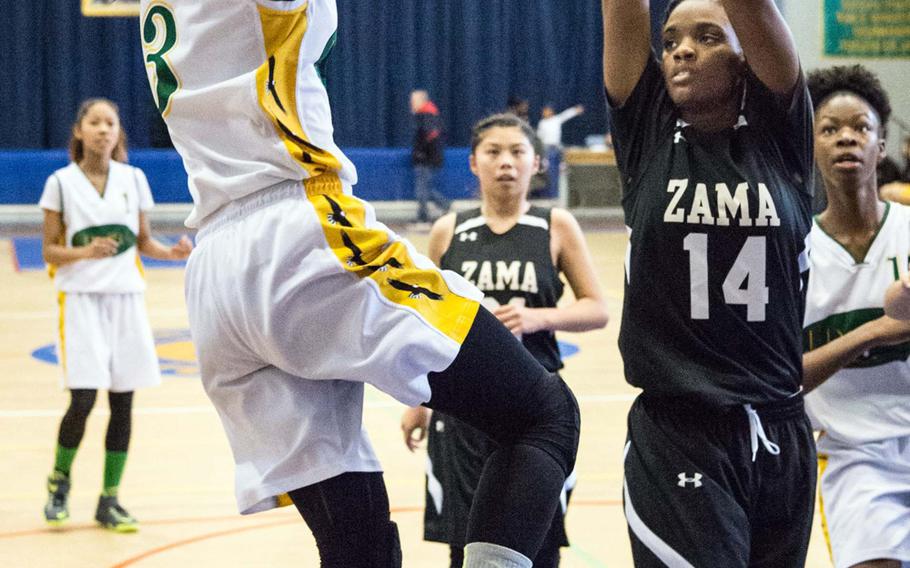 Robert D. Edgren's Karen Anastos puts up a shot over Zama's Tasia Nelson during Friday's DODEA-Japan tournament semifinal. The Eagles won 46-22 and face Yokota for the title on Saturday.
