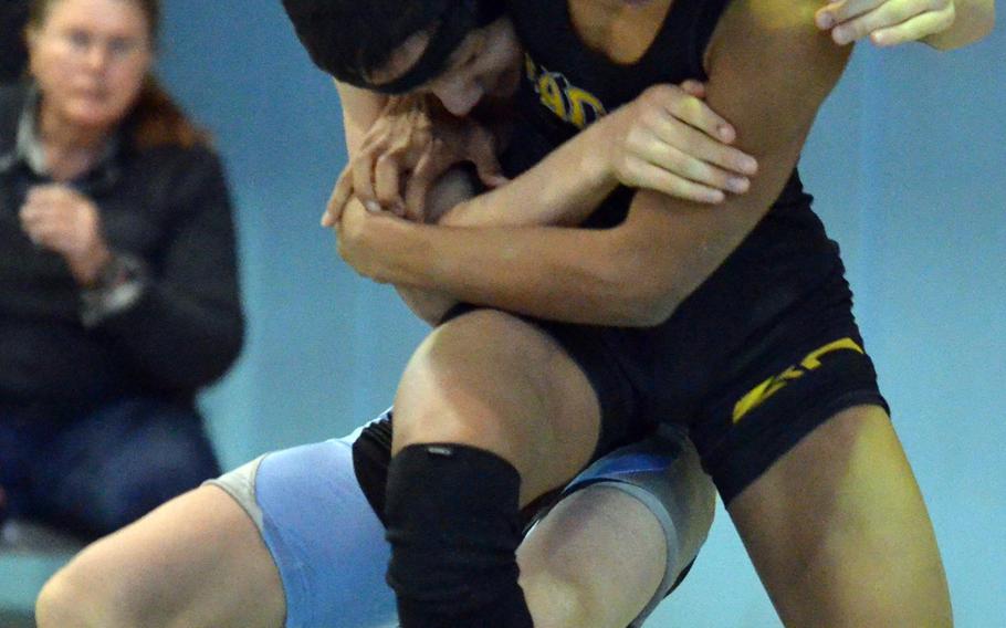Kadena's Austin Martino and Osan's Kojiro VanHoose struggle for control at 108 pounds during Thursday's championship bracket semifinal in the Far East High School Wrestling Tournament. VanHoose won by pin.