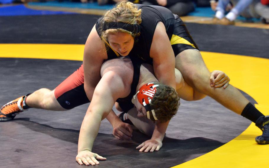 Kadena's James White gets the upper hand on Nile C. Kinnick's Marc Domery during Friday's heavyweight championship in the Far East High School Wrestling Tournament. Domery pinned White twice in a two-bout final, in 4:18 and 1:40.