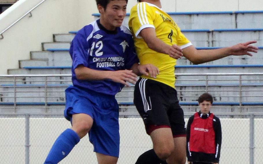 Kadena's Junta Callahan heads the ball against a Chubu Shogyo player during Saturday's boys soccer match, won by the Panthers 7-0.
