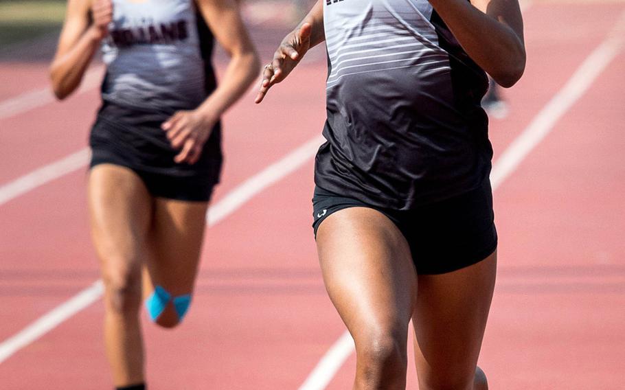 Zama senior Tasia Nelson pounds for the finish in Saturday's track and field meet at Yokota, where she won the 100 and 200.