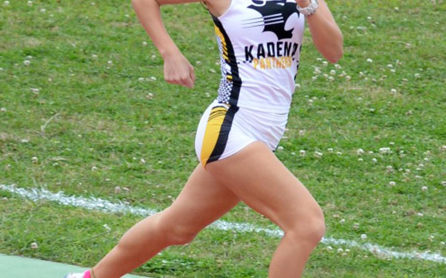 Kadena senior Wren Renquist approaches the finish of the 1,600 during Saturday's Okinawa track and field meet. Renquist won in 5:36.43.