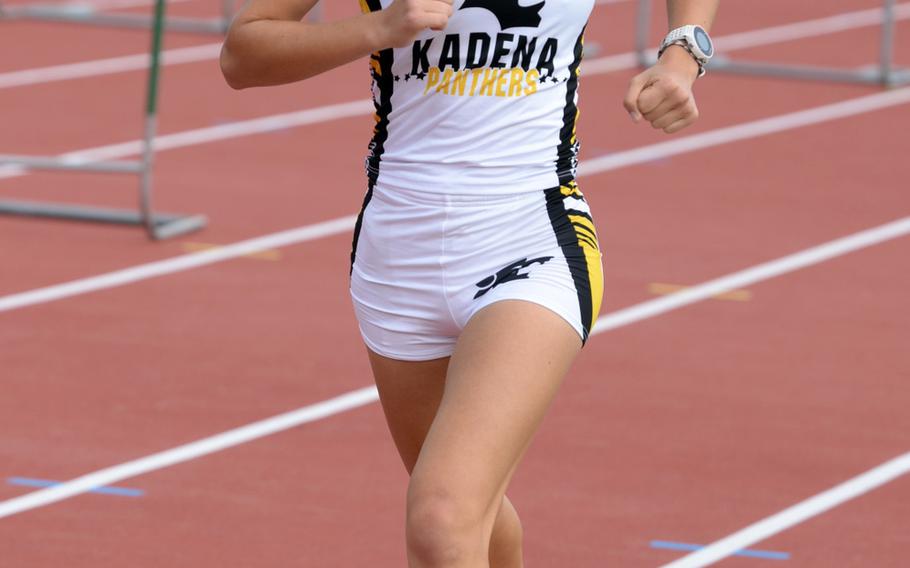 Kadena senior Wren Renquist heads to the finish line and to victory in the 3,200 during Friday's 13th Mike Petty Memorial Track and Field Meet. Rubero was timed in 12 minutes, 6.87 seconds.