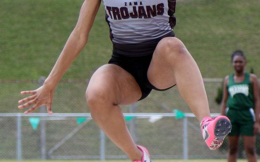 Zama junior Faith Bryant, the only athlete entered from off-island in the 13th Mike Petty Memorial Track and Field meet, hits a meet-best 4.73 in the long jump, winning the event, upsetting defending Far East champion Gabriella Provost and setting a personal and school best in the event.
