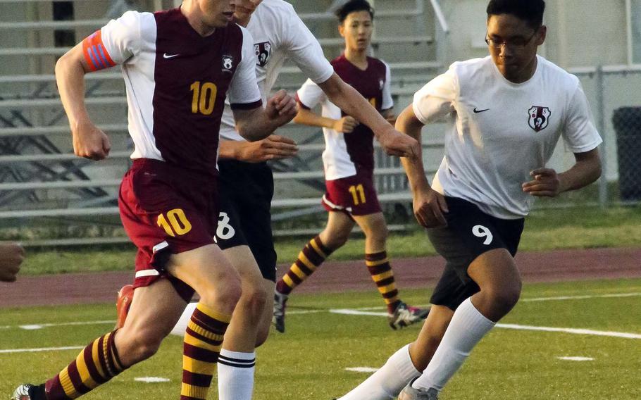 Matthew C. Perry's Aidan Lewis dribbles the ball alongside Zama's Isaac Norton and Aoi Bivins during Friday's boys soccer match, won by the visiting Samurai 3-2.