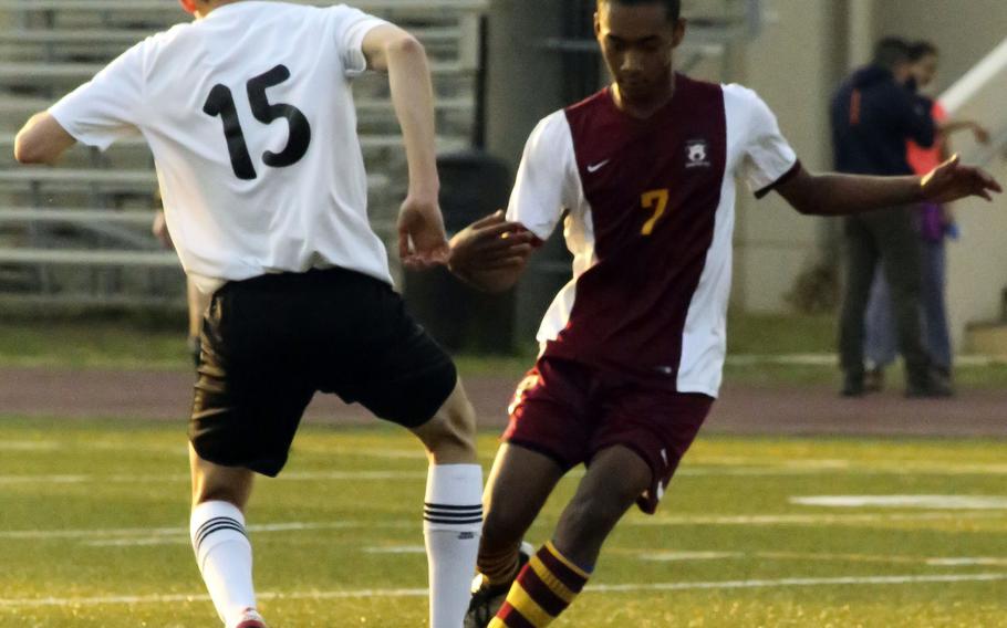 Zama's Shigeru Stuckey and Matthew C. Perry's David Shoebrook battle for the ball during Friday's boys soccer match, won by the visiting Samurai 3-2.