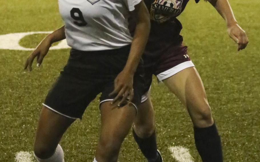 Zama's Kayesha McNeill and Matthew C. Perry's Maddi Swieczkowski battle for the ball during Friday's girls soccer match, won by the visiting Samurai 2-1.