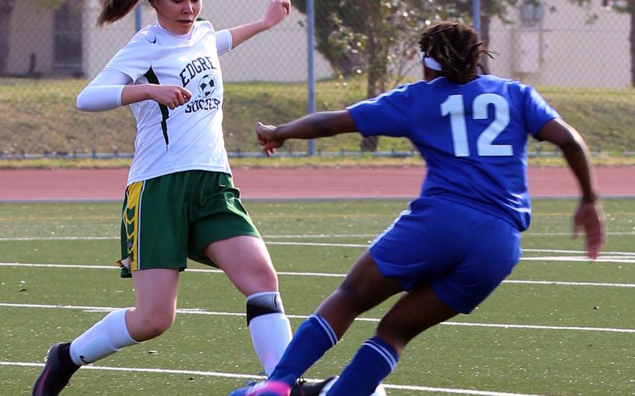 Robert D. Edgren's Ciana Bird and Yokota's Jamia Bailey battle for the ball during Friday's girls soccer game, won by the visiting Panthers 8-0.