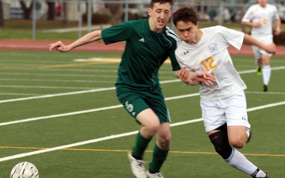 Robert D. Edgren's Sean Barry and Yokota's Keanu McElroy battle for the ball during Saturday's boys soccer game, won by the visiting Panthers 5-1.